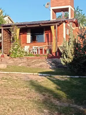 a house with a window on the side of it at Nahian in Mina Clavero