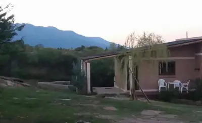 a house with a roof that is being torn up at Nahian in Mina Clavero