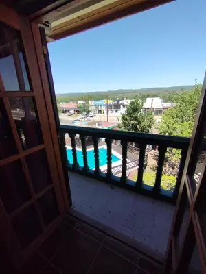 a view from the balcony of the pool at Pecas house in Mina Clavero