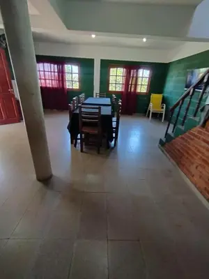 a dining room with a table and chairs at Pecas house in Mina Clavero