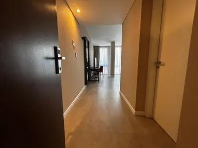 an empty hallway with a door to a room at Graciana Residences-Apart in Trapiche