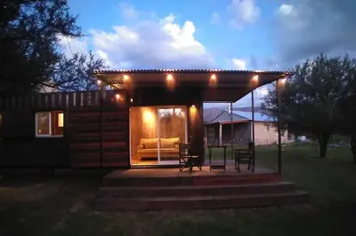 a small cabin with a couch in the yard at Casa Cosmos, Apart para parejas in Las Rabonas
