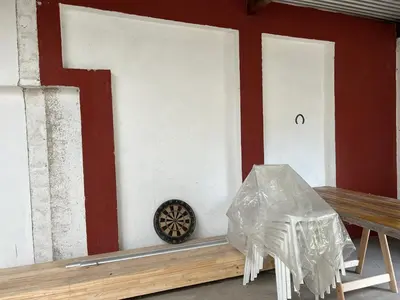 a room with a dart board and a wooden bench at Córdoba Shopping - ApartQ 3 in Cordoba