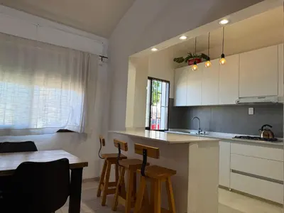 a kitchen with a counter and a table and chairs at Córdoba Shopping - ApartQ 3 in Cordoba