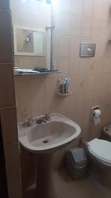 a bathroom with a sink and a toilet at CASA AMPLIA Y CONFORTABLE in Cordoba