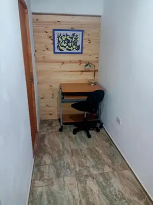 a desk with a chair and a lamp in a room at el escondido in Villa Cura Brochero