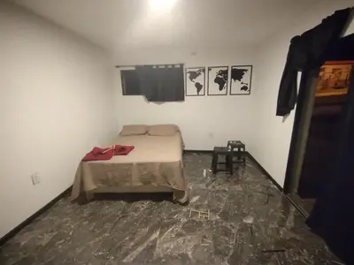 a small room with a bed in the middle of it at La Mora in Mina Clavero
