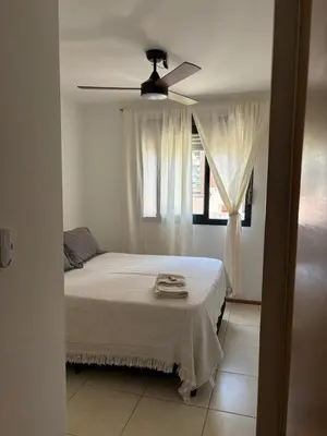 a bedroom with a bed and a ceiling fan at Departamento Centrico Nueva Cordoba in Cordoba