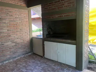 an outdoor pizza oven in a brick wall at Departamento LAS ARAUCARIAS in Arroyo de Los Patos