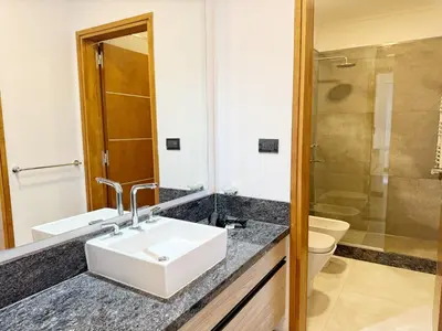 a bathroom with a sink and a toilet and a shower at Constantino 6 Apartments in Villa Carlos Paz