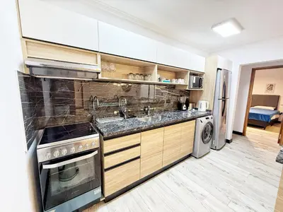 a kitchen with a sink and a dishwasher at Constantino 6 Apartments in Villa Carlos Paz
