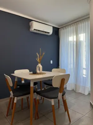 a dining room with a table and chairs at Departamento cómodo y confortable en Córdoba Capital in Cordoba