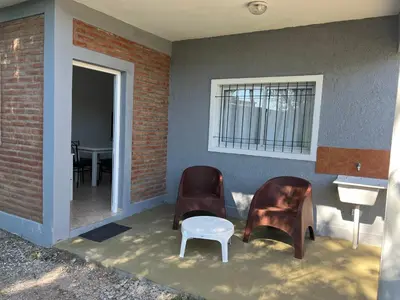 a room with two chairs and a sink and a table at Bella Luna apart in Mina Clavero
