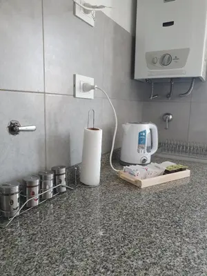 a kitchen counter with a coffee maker and a mixer at CR Apartment in Cordoba