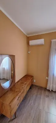 a room with a large mirror and a wooden table at Patuli House - Casa alquiler temporario Córdoba in Cordoba