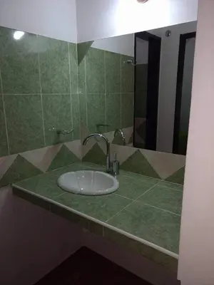 a bathroom counter with a sink and a mirror at Tu lugar en Tierra Santa in Villa Cura Brochero