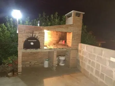 a brick oven with a pizza inside of it at Tu lugar en Tierra Santa in Villa Cura Brochero