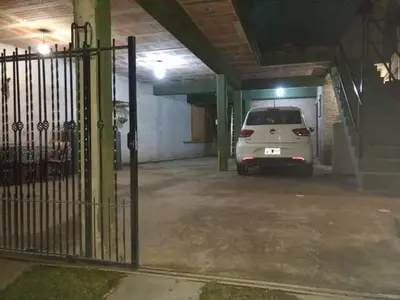 a white van parked in a parking lot at Tu lugar en Tierra Santa in Villa Cura Brochero