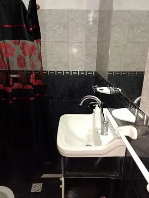 a bathroom with a sink and a mirror at Tu lugar en Tierra Santa in Villa Cura Brochero