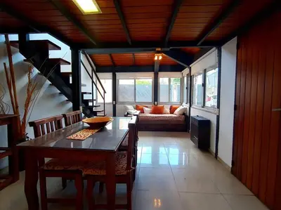 a living room with a table and a couch at Cómodo Depto en B Villa Belgrano in Cordoba