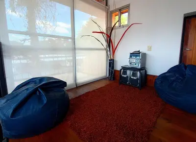 a room with two blue bean bags and a window at Cómodo Depto en B Villa Belgrano in Cordoba