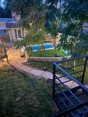 a staircase leading to a house with a swimming pool at La Casita Yogui - MONOAMBIENTE 1 in Santa Rosa de Calamuchita