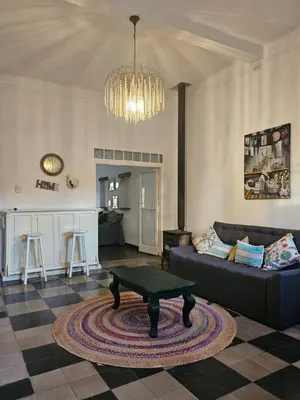 a living room with a couch and a table at Martinolli5130 in Cordoba