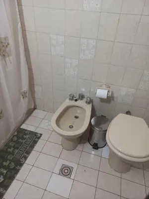 a bathroom with a toilet and a bidet at Departamento interno con dos camas individuales in Cordoba
