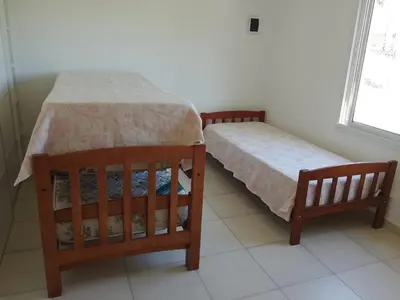 two beds sitting next to each other in a room at Casa Villa Amancay in Villa Amancay