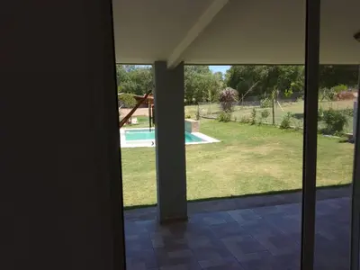 a view of a yard from the inside of a house at Casa Villa Amancay in Villa Amancay