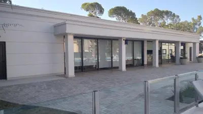 a building with a lot of windows at Costanera Park in Cordoba