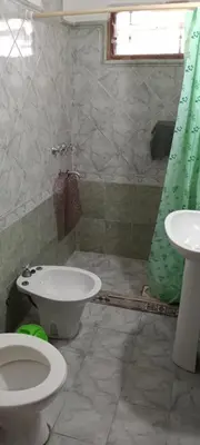 a bathroom with a toilet and a sink at El central in Tanti