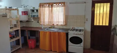 a small kitchen with a stove and a sink at El central in Tanti