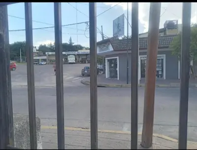 a view of a parking lot from a window at El central in Tanti