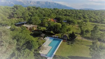 an aerial view of a house with a swimming pool at Cortaderas Hotel de Campo Nono in Nono