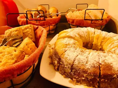 a group of cakes and pies on a table at Cortaderas Hotel de Campo Nono in Nono