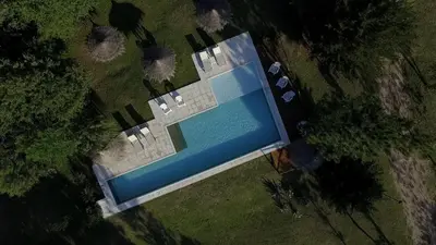 an overhead view of a building with a swimming pool at Cortaderas Hotel de Campo Nono in Nono