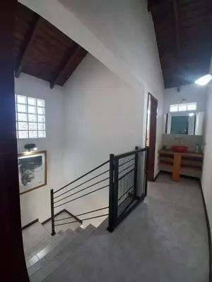 a hallway with a staircase in a building at Tantanakuy in Villa General Belgrano