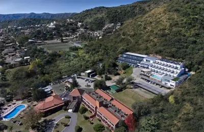 an aerial view of a resort with a mountain at Pinares Panorama Suites, Spa & Convention Center in Villa Carlos Paz