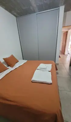 a bedroom with a bed with two towels on it at Casa Buda in Almafuerte