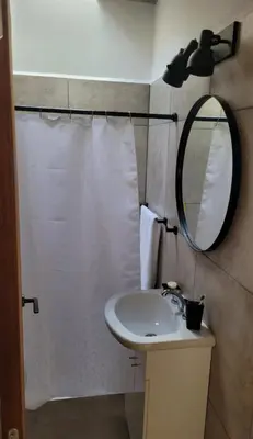 a bathroom with a sink and a mirror at Casa Buda in Almafuerte