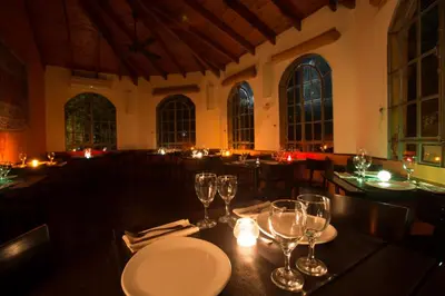 a dining room with a table with wine glasses at Las Nubes Apart in Merlo