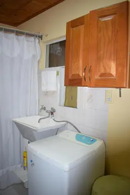 a bathroom with a toilet and a sink at El sueño de Norma in San Antonio de Arredondo