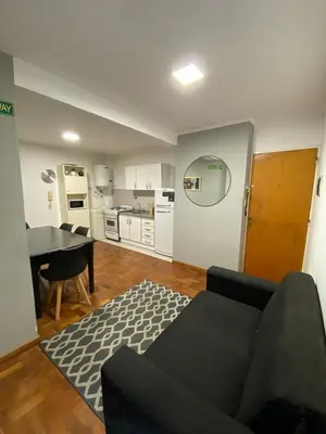 a living room with a couch and a table at Cómodo departamento, excelente ubicacion in Cordoba