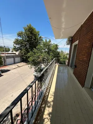 a walkway next to a building with a fence at Departamento Balneario (Centro) in Villa Dolores