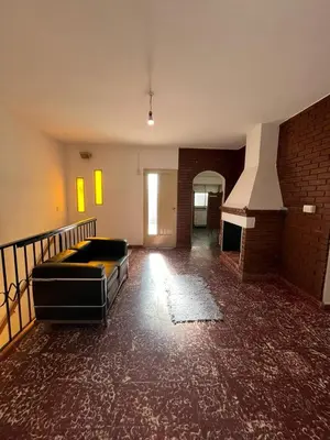 a living room with a couch and a fireplace at Departamento Balneario (Centro) in Villa Dolores