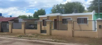 a house on the side of a street at La Delia in Villa Cura Brochero