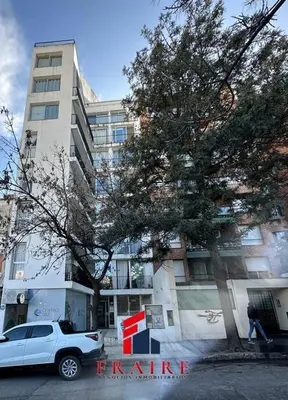 a white truck parked in front of a building at Increíble dto de 1 dorm en Nva Cordoba in Cordoba