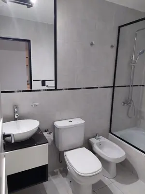 a white bathroom with a toilet and a sink at Increíble dto de 1 dorm en Nva Cordoba in Cordoba