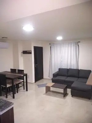 a living room with a couch and a table at Miralejos Apart Triplex in Villa Carlos Paz